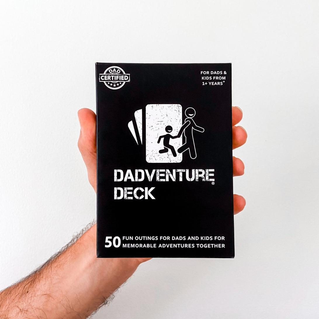 The Dadventure Deck box held in one hand